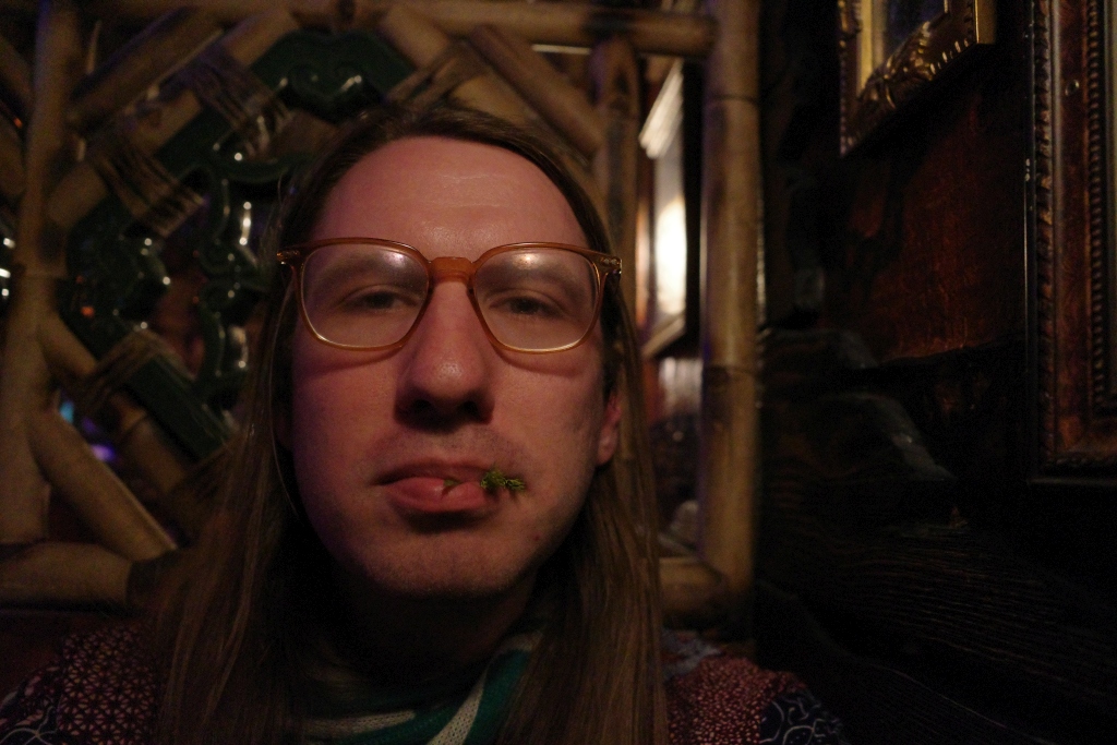 Self-portrait from a friend's birthday celebration at Inside Passage. 

Nibbling on a drink garnish only whet my appetite for some Hawk Dogs soon after.