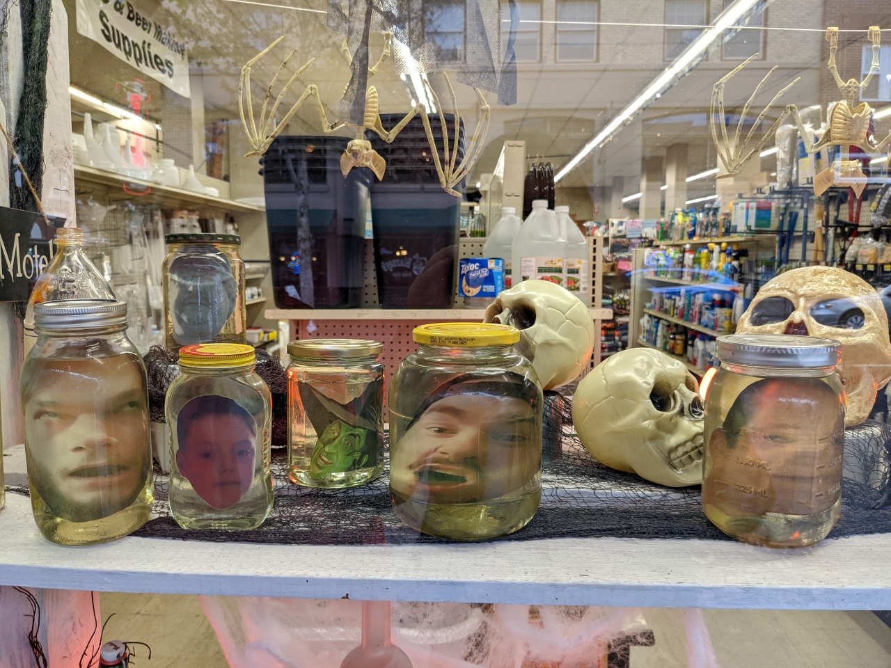 Among this hardware shop's bizarre decorations were some attempts to show employees' shrunken heads in jars.