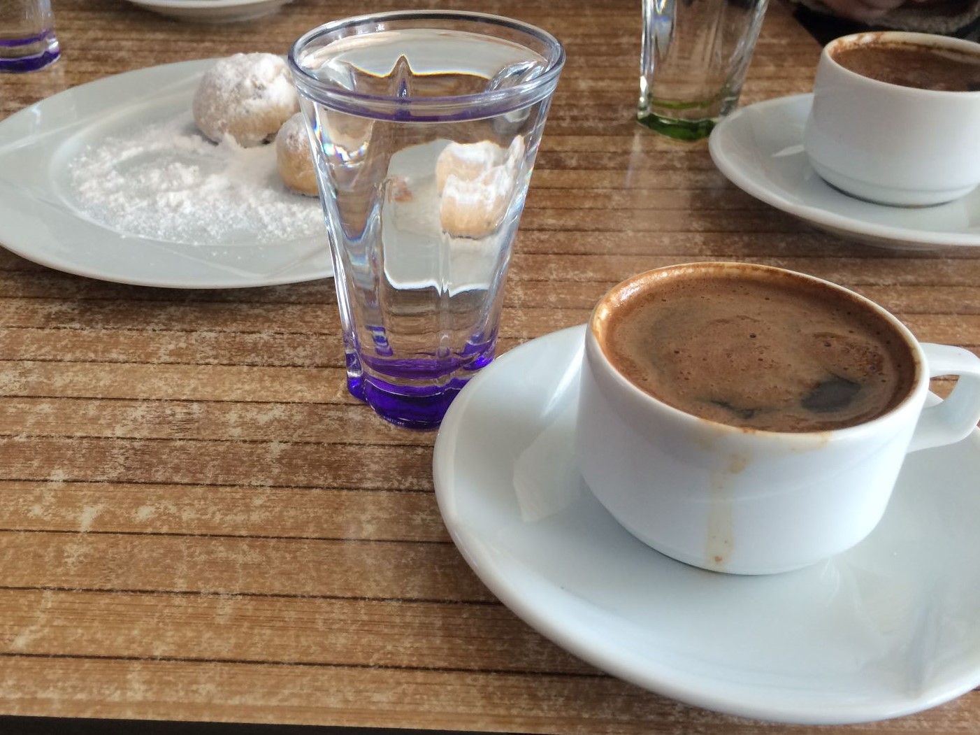 A beautifully presented coffee alongside Greek pastries, somewhere on Gökçeada. April 2016.