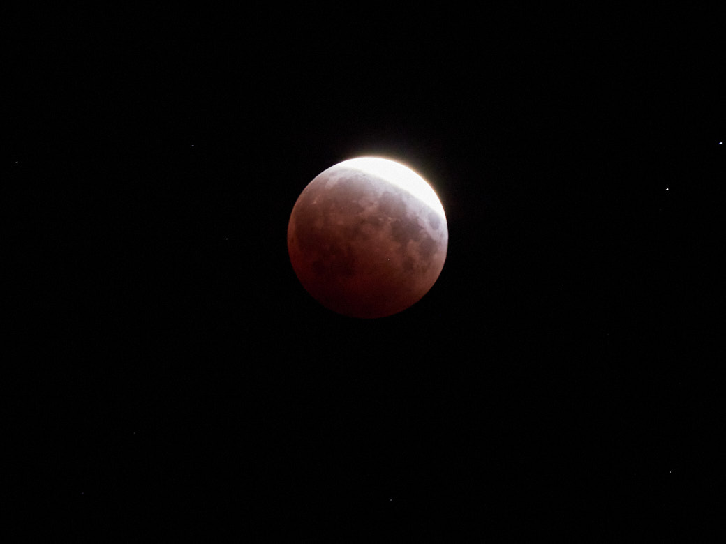 The May 26, 2021 super blood moon lunar eclipse, or what have you, happened while I was staying in Hana. Despite heavy cloud cover, and the fact that the moon was moving... behind the house I was using as a vantage point, I managed to snap a couple of pics.