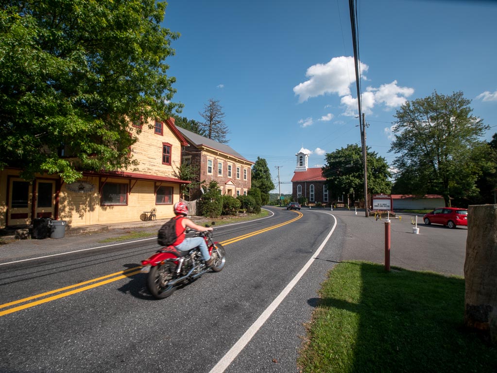 A biker passes through the center of Alleghenyville