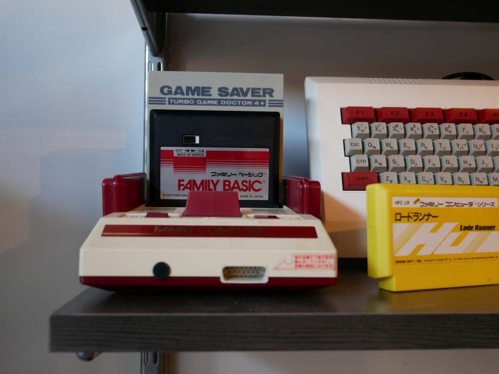 A Nintendo Famicom (1983) with a copy of Family BASIC (1984). It's rather startling how much more svelte this console and its cartridges were compared to the 'bigger is better' American Nintendo Entertainment System.