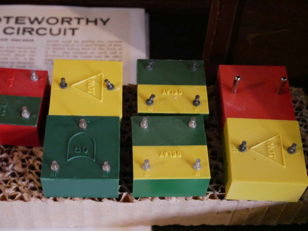 These blocks are part of a children's toy for learning analog computing. They are positioned in a pin-board and connected with alligator clips. According to Bill, the only other extant version of this game that he's aware of is in the Smithsonian