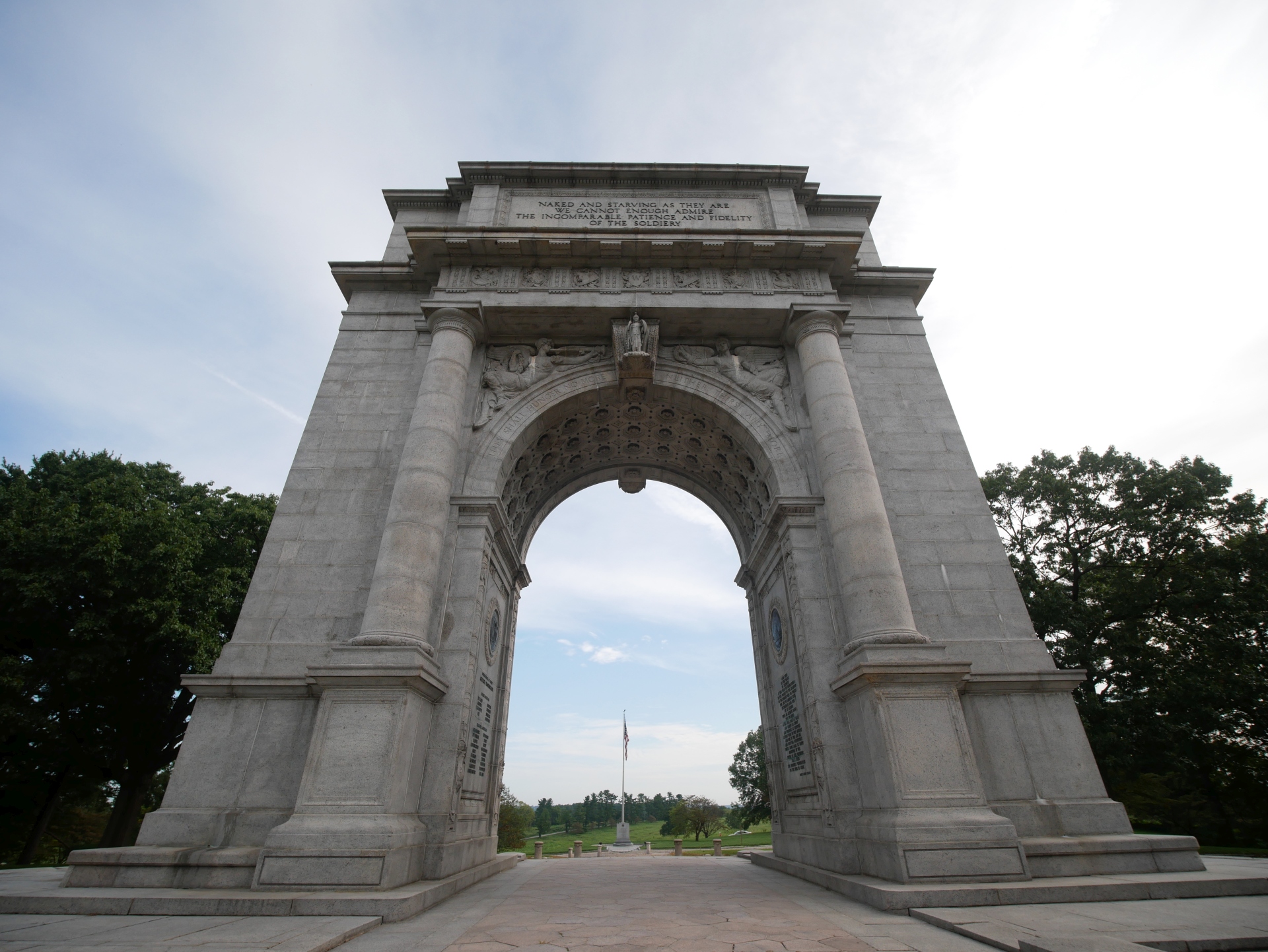Looking back through the National Memorial Arch, glimpsing the American Flag. September 2020.