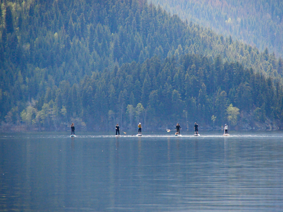 The lake is surrounded by nearby resorts, and paddle boarding appeared quite popular.